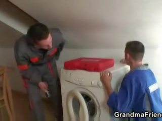 Two repairmen bang busty grandma from both ends